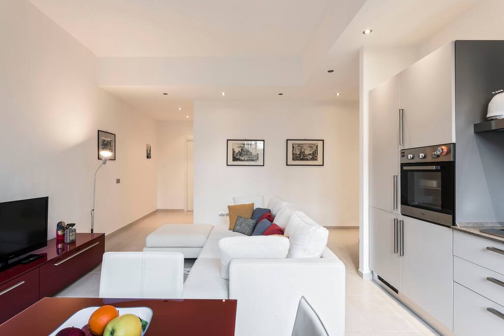 The Living room & The Kitchen - The dining table & The bed sofa