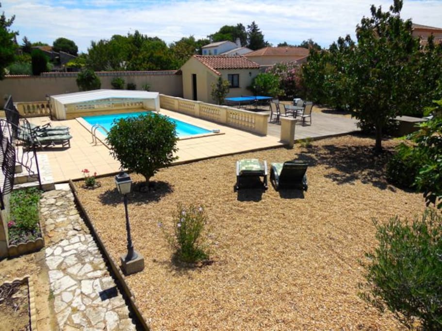 Swimming pool located in rear secluded garden
