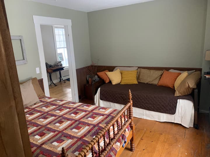 The Den Suite: This downstairs bedroom at the Homestead is connected to a full bath and sleeps 2 (3, if you want to snuggle up). (1)-antique bell and ball bed and (1) fully functional hospital bed, perfect for guests who may have mobility issues.
