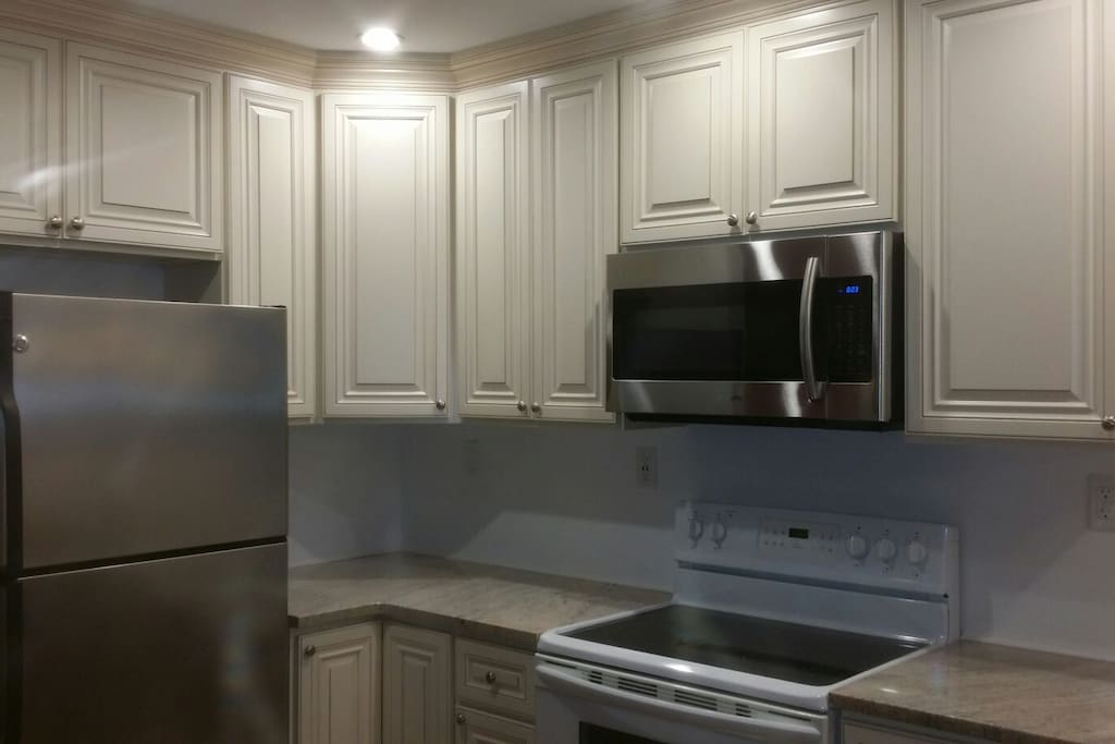 Awesome kitchen w granite, microwave electric oven, view of bay, plenty of storage.