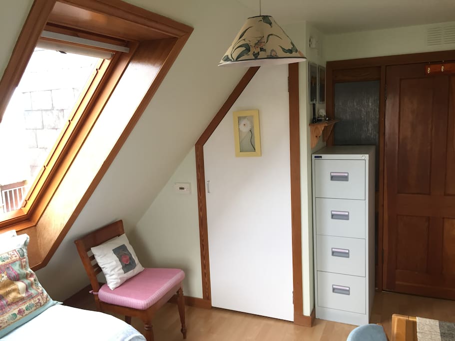 Velux window to the north, and hanging space in the cupboard