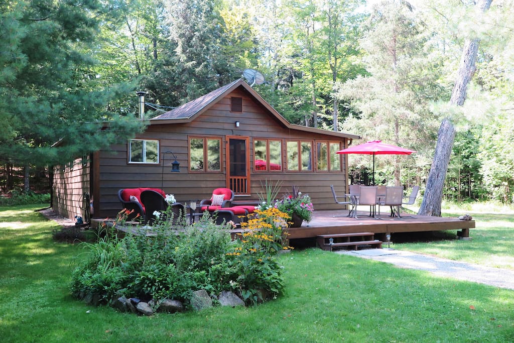 The front of the cottage. 300 feet away from the shoreline. You can see the lake a bit through the forest.