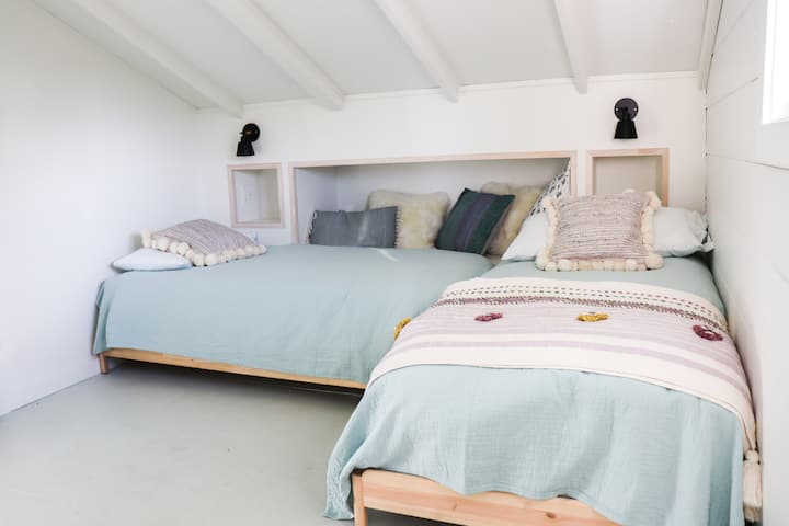 Bedroom 2 with two twins or one king, plus a sleeping nook in the wall