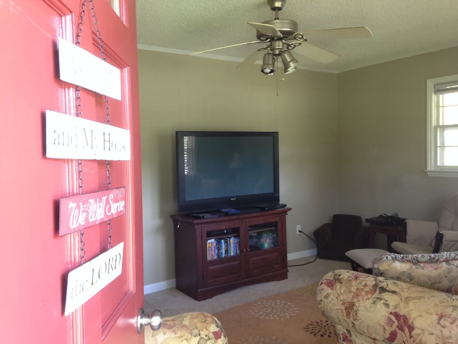 Living room with Satellite tv, Xbox 360 and lots of DVDs