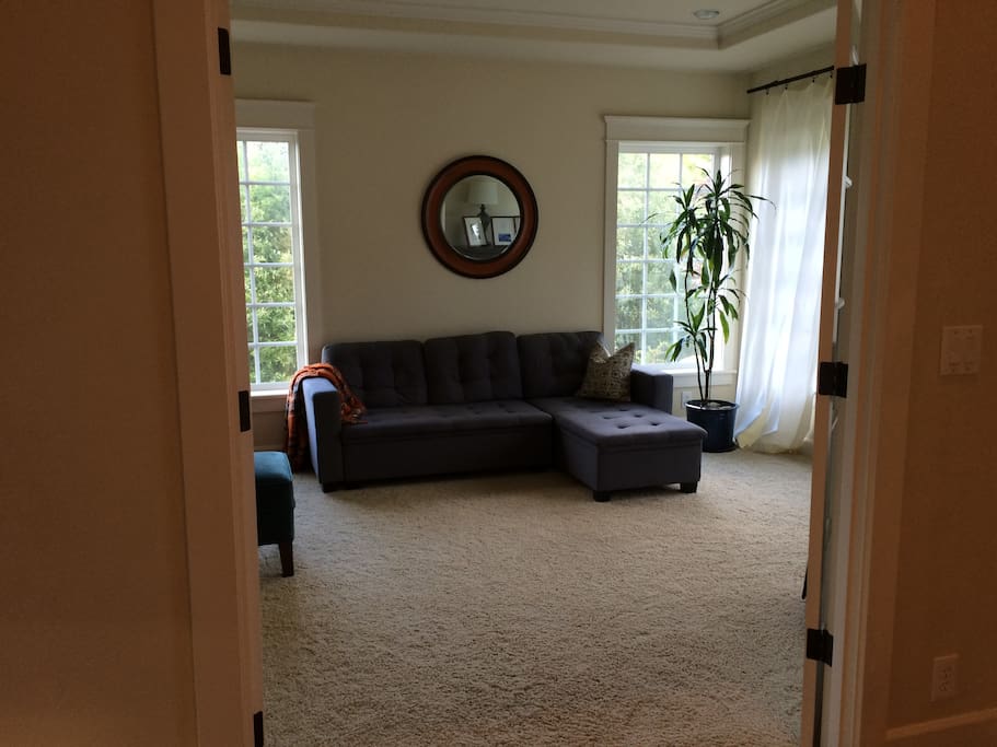 Front sitting room doubles as 4th bedroom with blow-up bed.