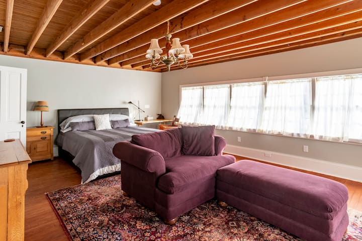 The King Suite has a large sitting area, luxurious king bed and private bath with shower.  