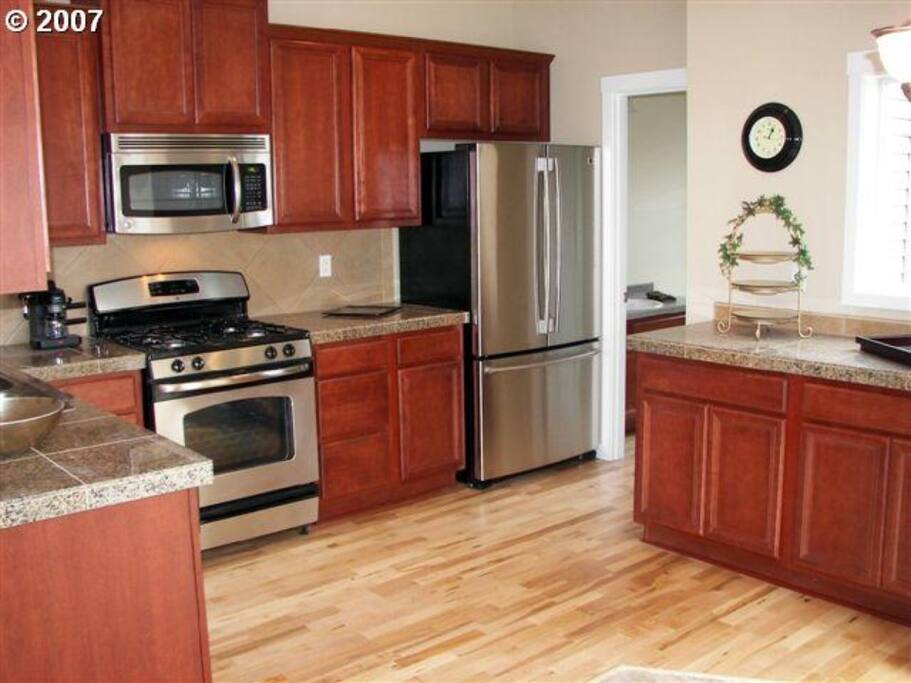 Gas range, large refrigerator, dishwasher, coffee maker