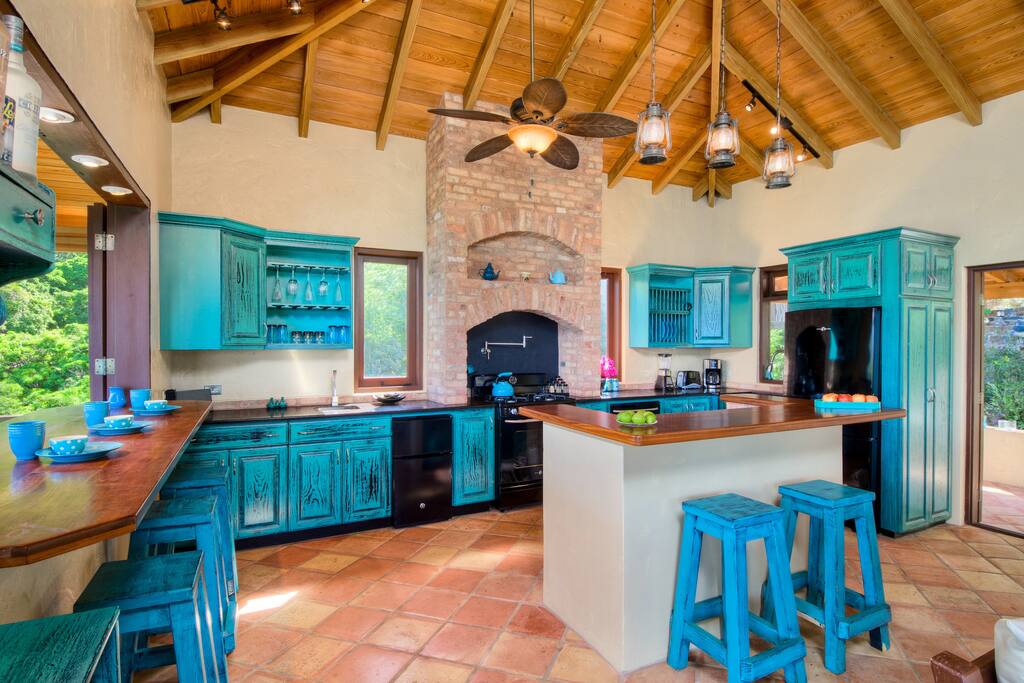 well equipped kitchen with dining island and indoor/outdoor eating bar.
