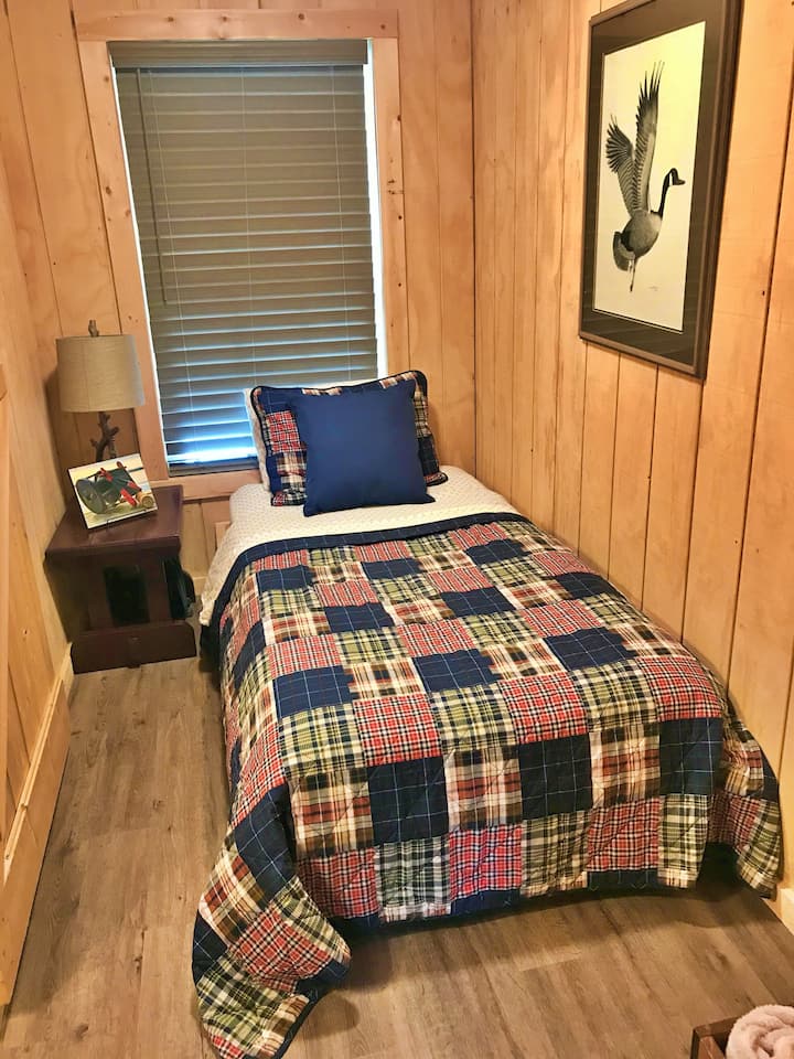 Bedroom 2. Twin bed with portable fan.