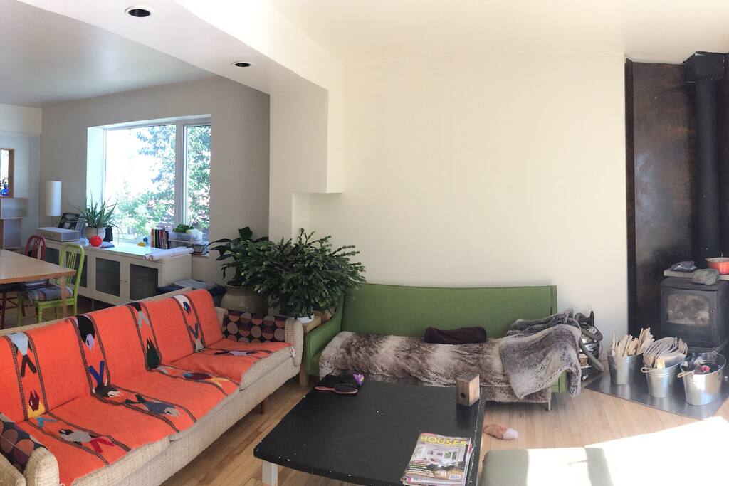 Dining/work area (to right), living room (from entry).