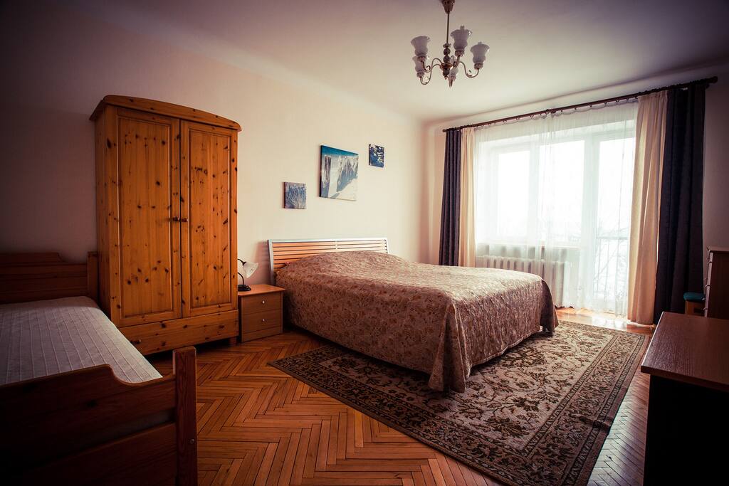 Spacious bedroom with balcony and view on Daugava river