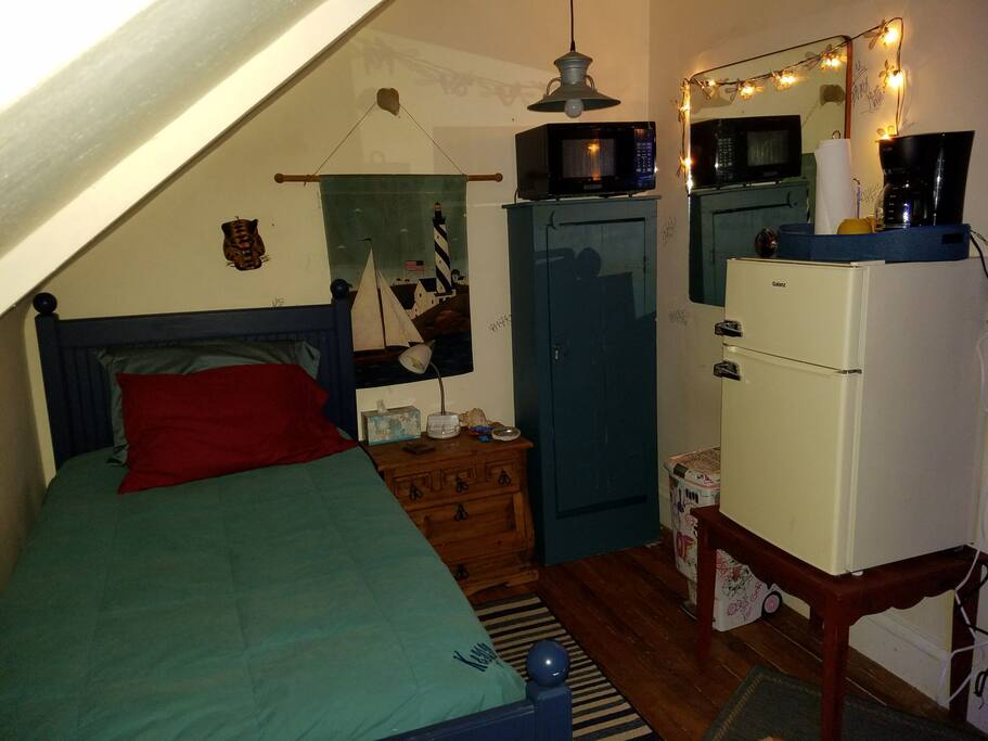 Comfy Twin Bed Area of Larger Bedroom.