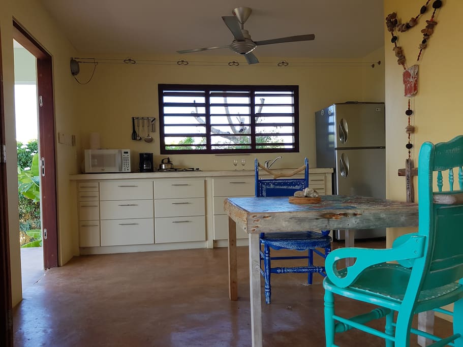 Artistic table and comfortable chairs made by neighbor Germaine.