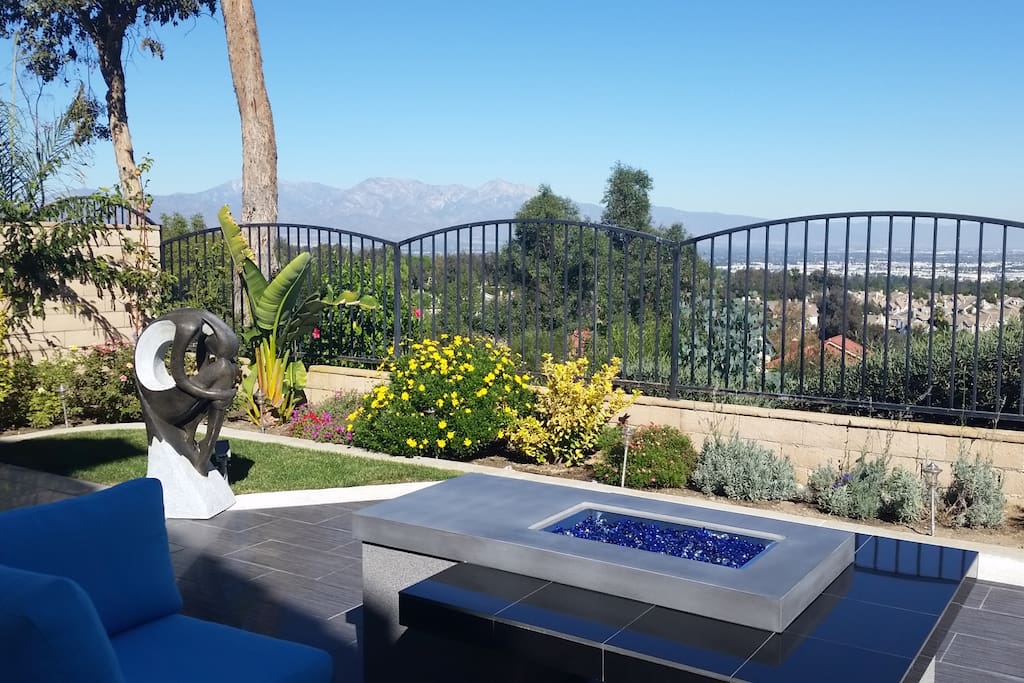 Backyard - newly updated - has a beautiful view of the mountains and city light w/ fire place