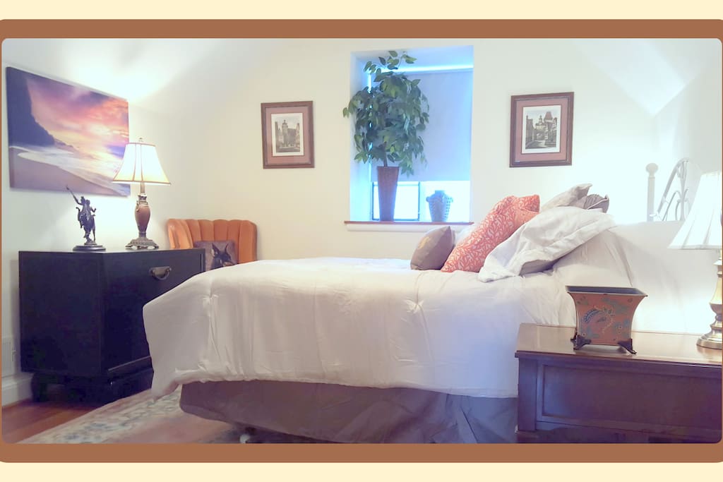 Private 2nd level bedroom 12' X 10.5 includes Queen bed, ceiling fan, and hardwood floors