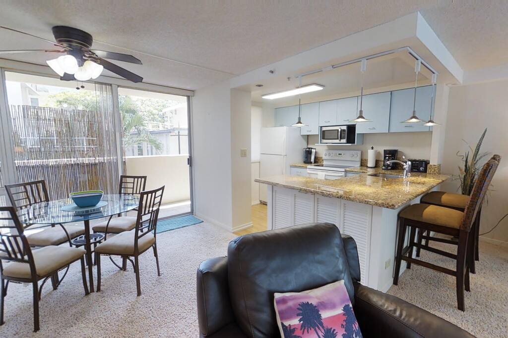 Hightop seating for two at the marble breakfast nook. Computer workstation / desk.
