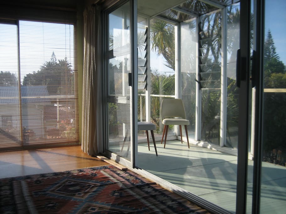 Sliding doors to partially enclosed deck. It's a sun trap!