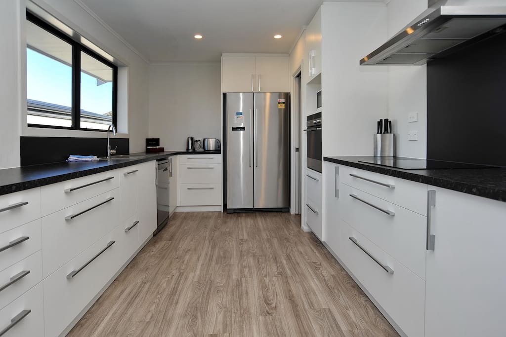 The spacious kitchen is fully equipped