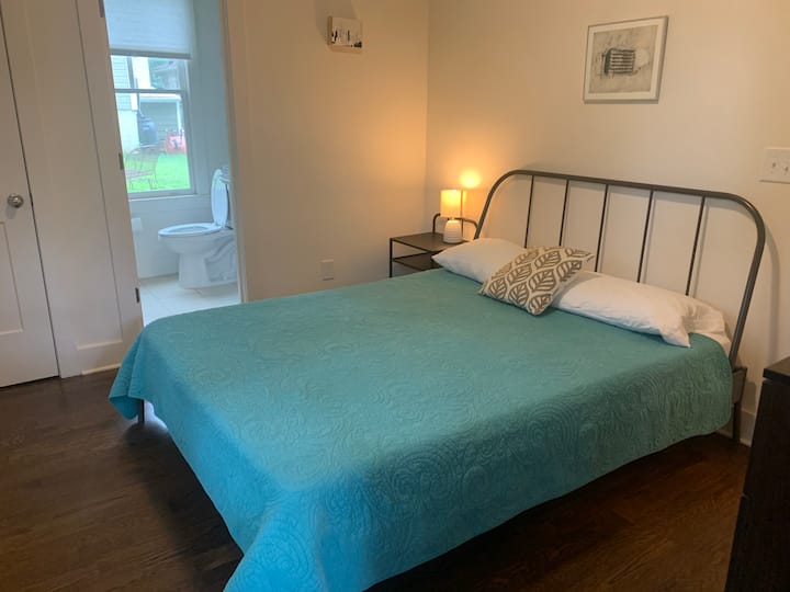 Bedroom #1 with en-suite bath, including stand-up shower. This room can be locked off from the rest of the cottage and has its own entrance. 