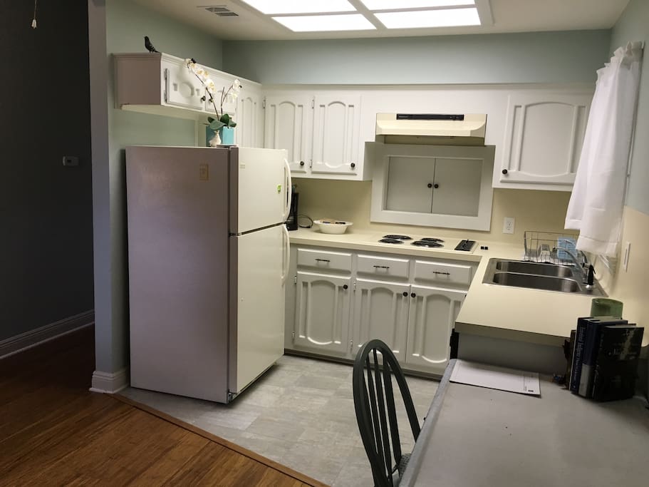 Kitchen with refrigerator, range, dishwasher