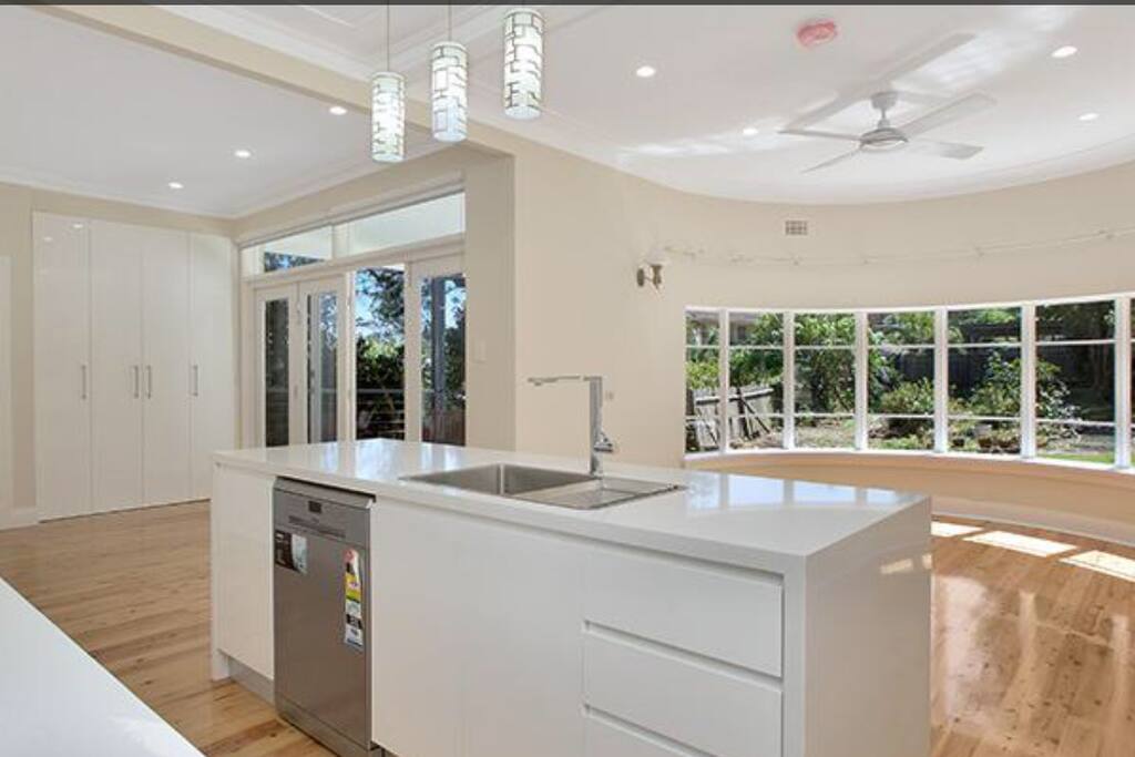 Modern kitchen, dining and living area