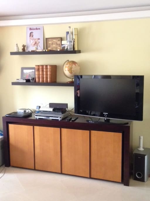 Living room, flat-screen tv with DVD player and 5.1 sound system.