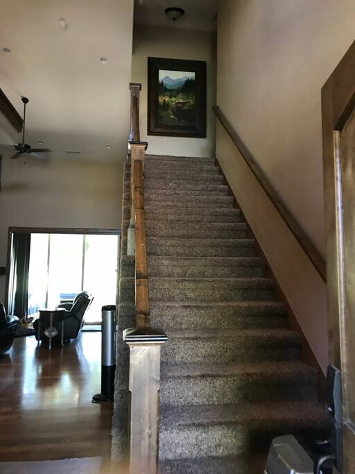 Through the front door straight upstairs.