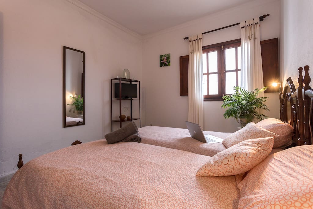 a colorful room with double or single beds