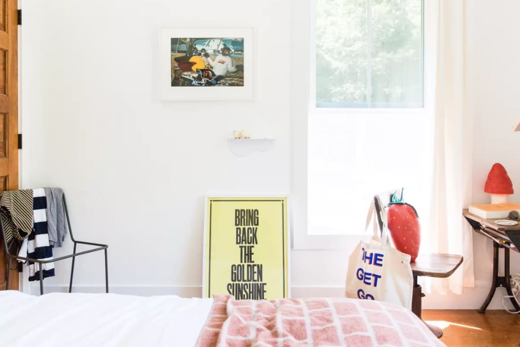 Master bedroom with queen bed and writing desk.