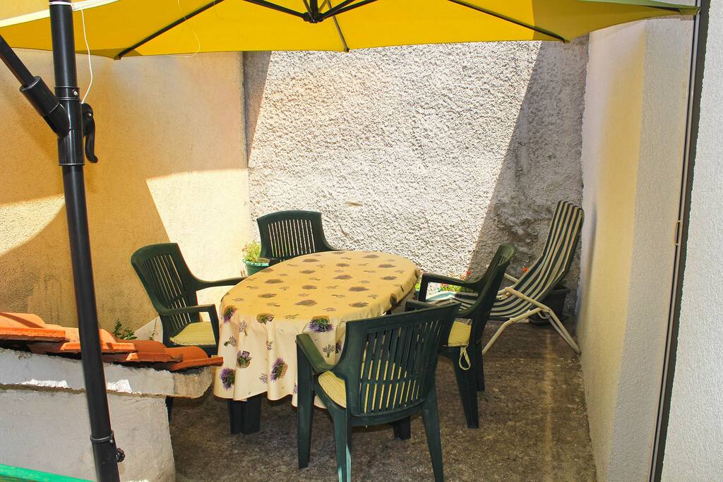 Lovely terrace with a bright parasol