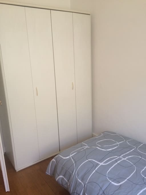 Double wardrobe in single room