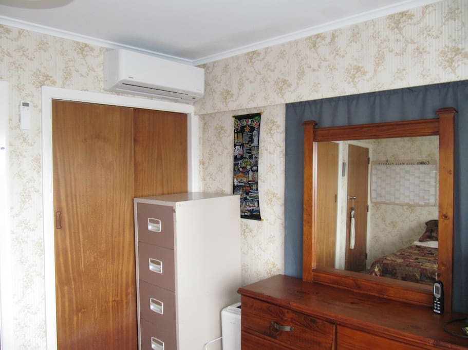 Room has cup board, dresser and Heat pump