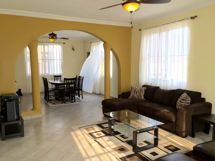 Beautifully set up living and dining rooms with AC, digital tv, music system, buffet table, just to mention a few.