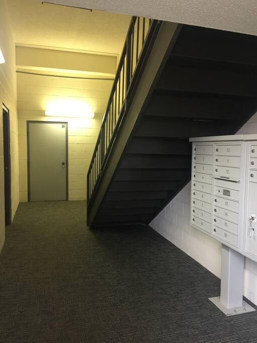 Stairs leading up to the apartment level.