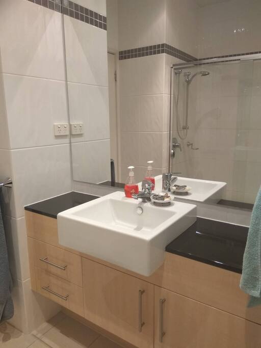 En suite bathroom with enormous shower and separate toilet.