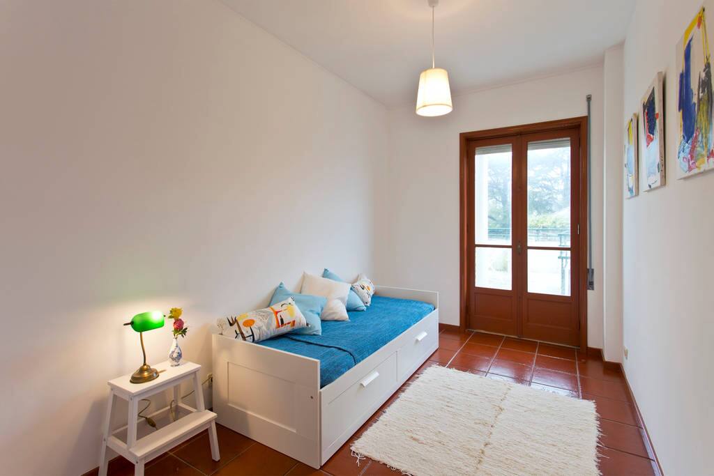 Bedroom 2 - It has a sofa that turns into a large bed, ideal for a couple. It also has access to the balcony.