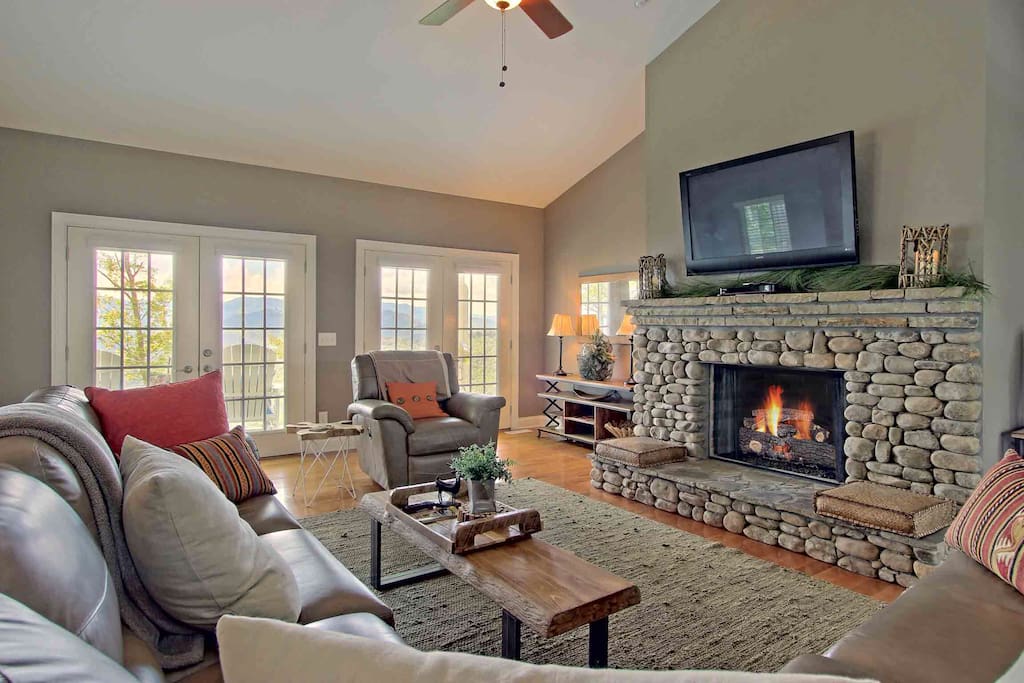 Snuggle up in front of the gas fireplace and enjoy the view. The chair is a recliner and there is another recliner in the sectional sofa.