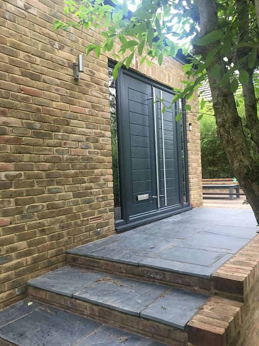 Double doors to front porch area, private patio around, lovely garden planted to the front, 20 ft up and 50 ft back from the quiet road, views into withdean woods, completely private and not overlooked.