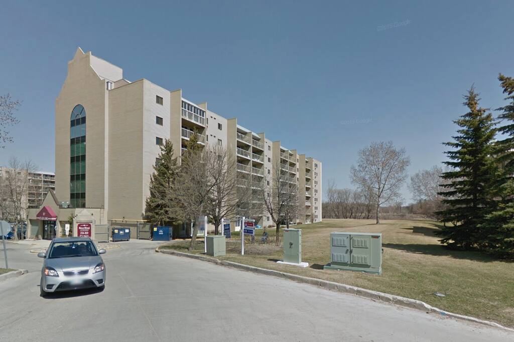 Front of building, backs on onto the Red River