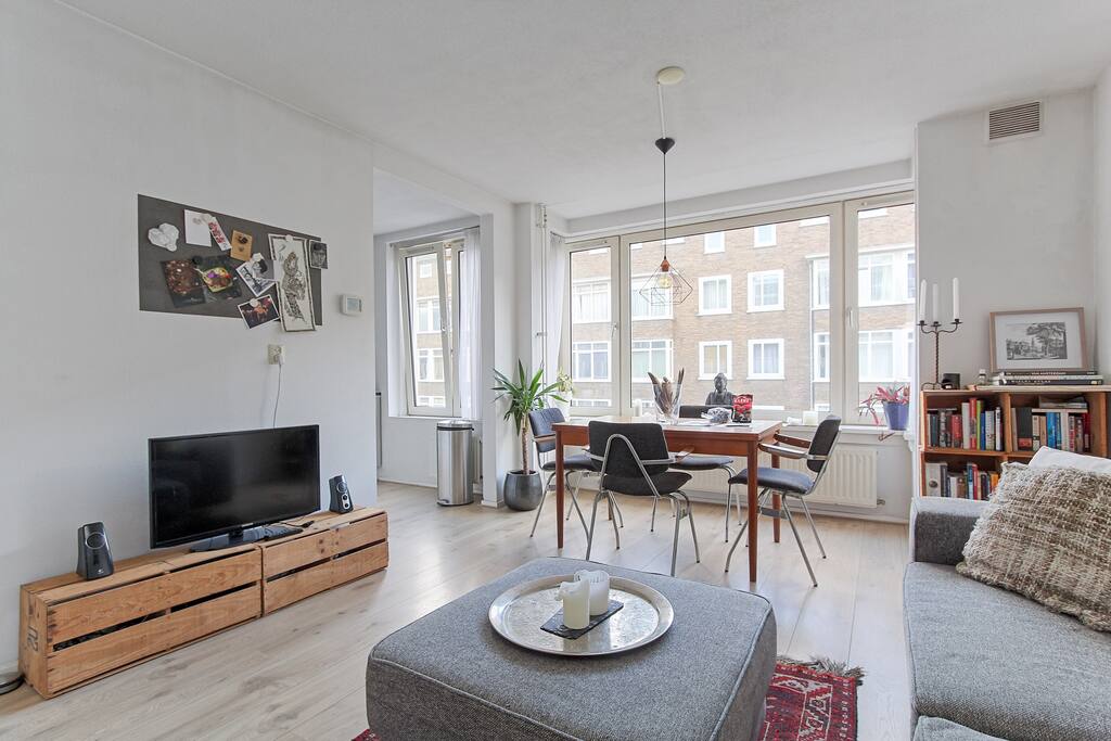 Spacious living room and adjacent kitchen where you can dine with loved ones and chill after a day in the beautiful city center.