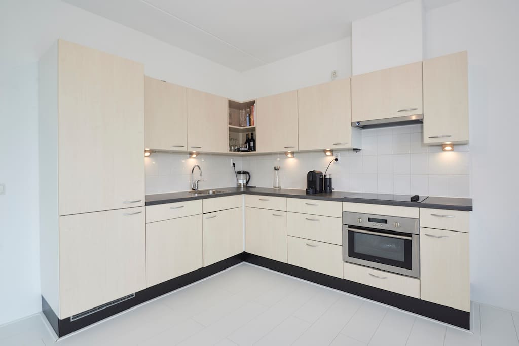 The kitchen is modern and fully equipped.