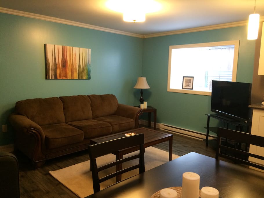 The living room is bright and cheerful with a TV provided, Satellite package included.