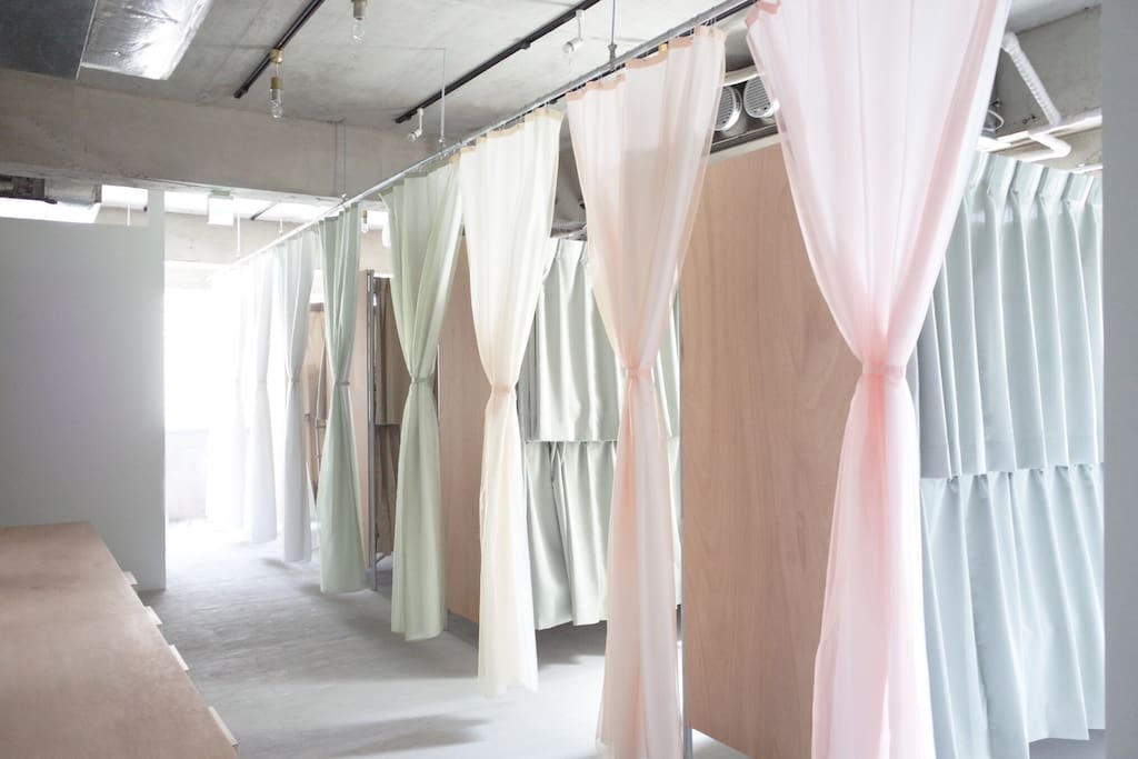 a dorm with curtains to isolate rooms