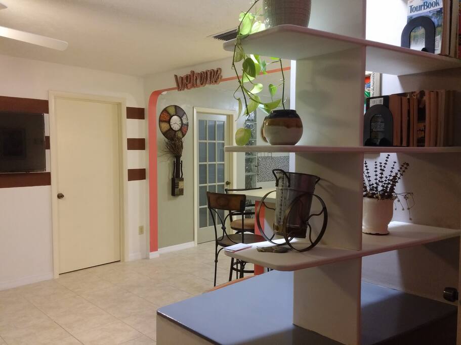 living room and kitchen area. the glass door give access to a 3th bed room with twin bed