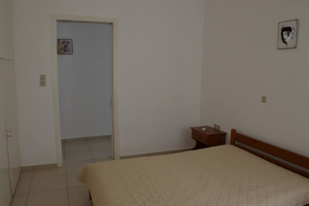 Bedroom with a double bed ans a sofa-bed