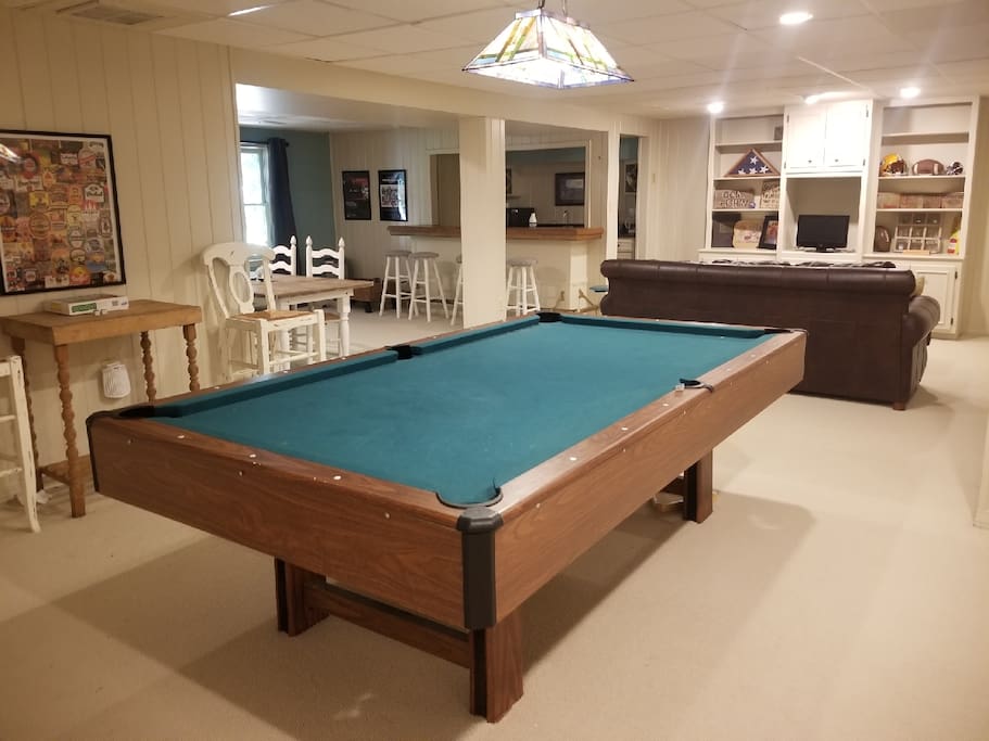 Play a game of pool or enjoy games or movies located in the cabinets