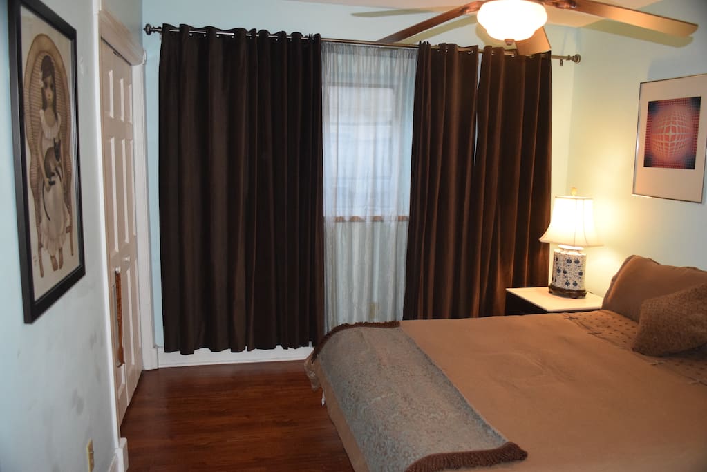 Room is spacious with good reading light by the bed.