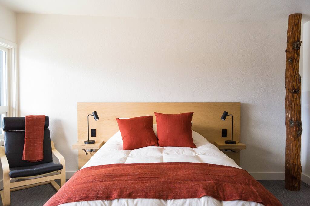 Modern, simple, clean, and functional, with an aesthetic nod to the Pacific NW, the Heliotrope features a custom built bed & cabinetry, & a red alder tree coat rack.