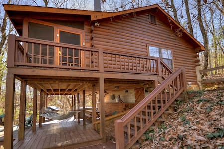 Laughing Hippo is a classic mountain cabin that sleeps 4 with large decks and a hot tub!