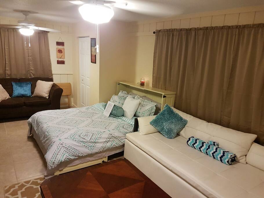 Modern futon couch with pull out memory foam mattress